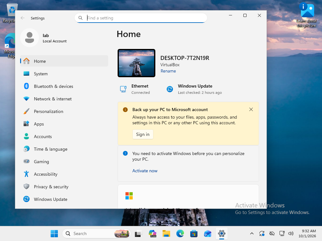 Windows Settings Home inside the documentation guest. The signed-in identity is labeled Local Account and the computer identifies as VirtualBox. Continue to System > About to verify the edition.
